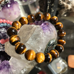 Made with top-quality natural brown tiger eye gemstones, this handmade bracelet provides protection, spiritual grounding, awareness, and chakra balance.